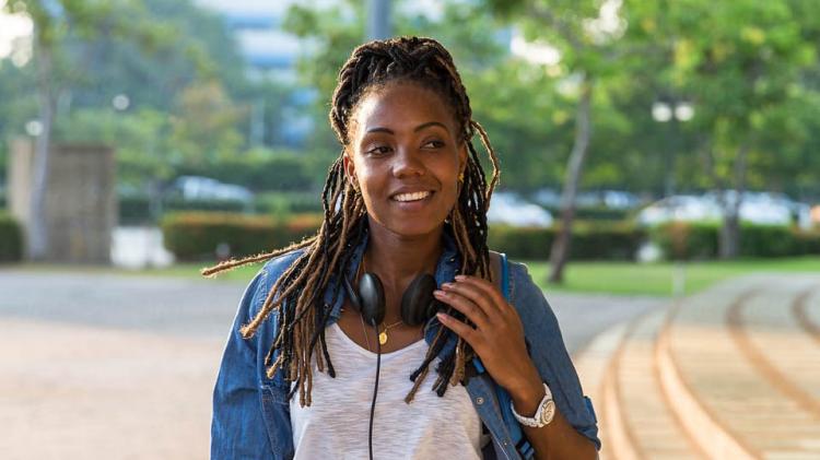 girl with headphones outside