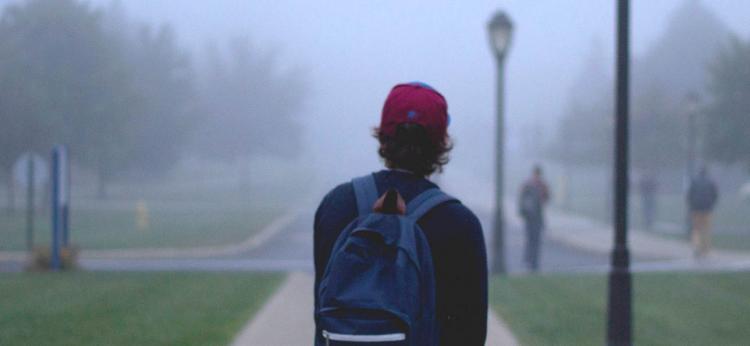 boy walking off into distance