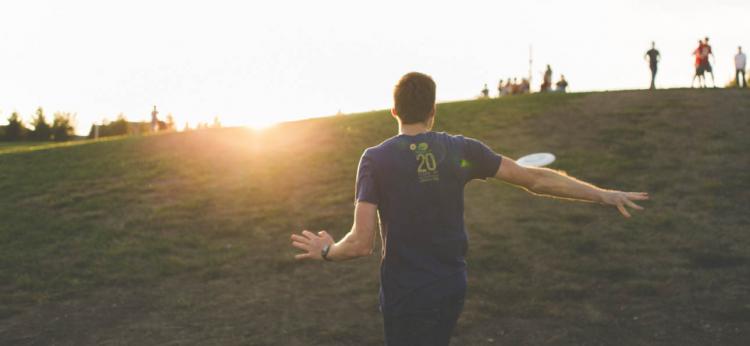 man throwing frisbee